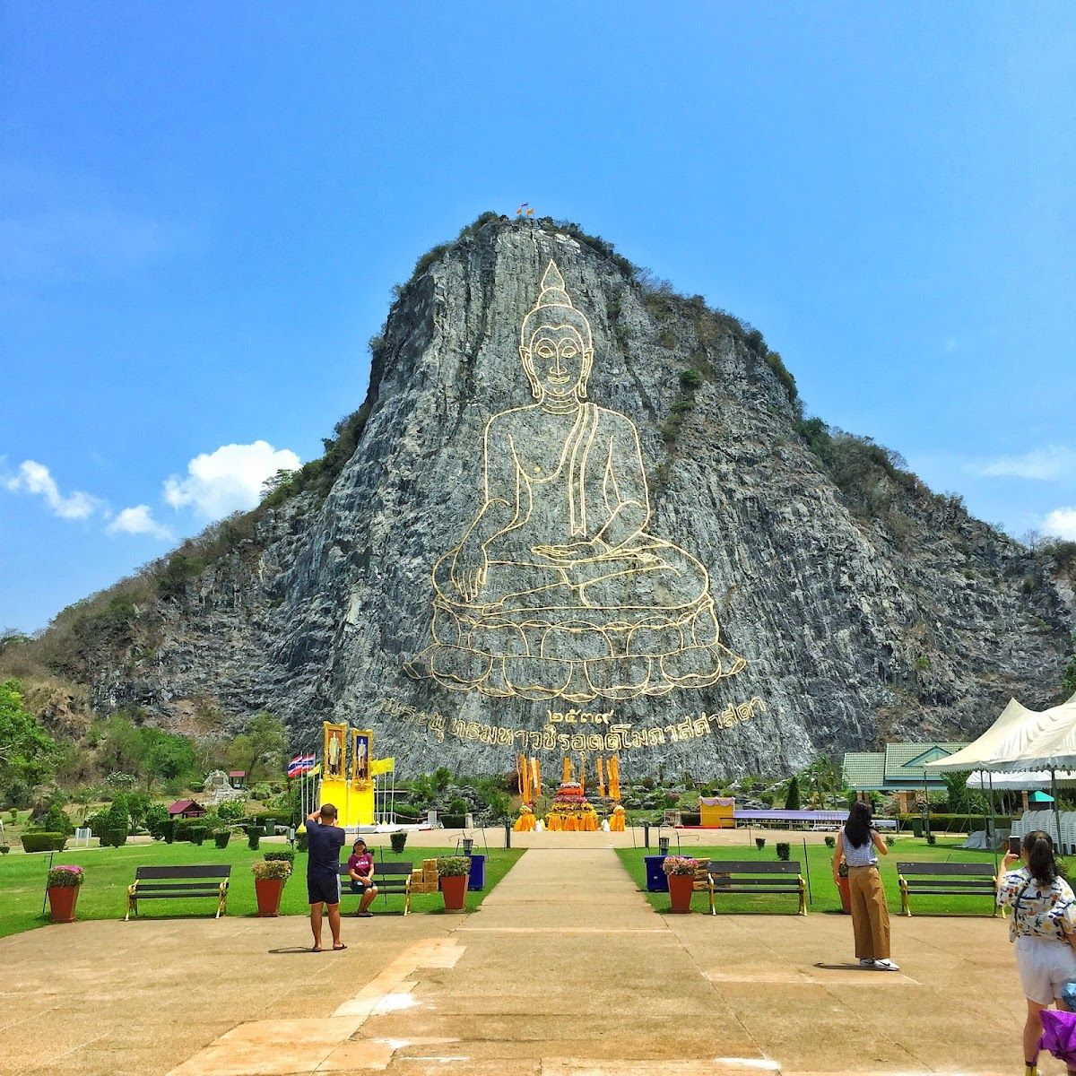 Massive gold Buddha image etched into cliff face at Khao Chi Chan