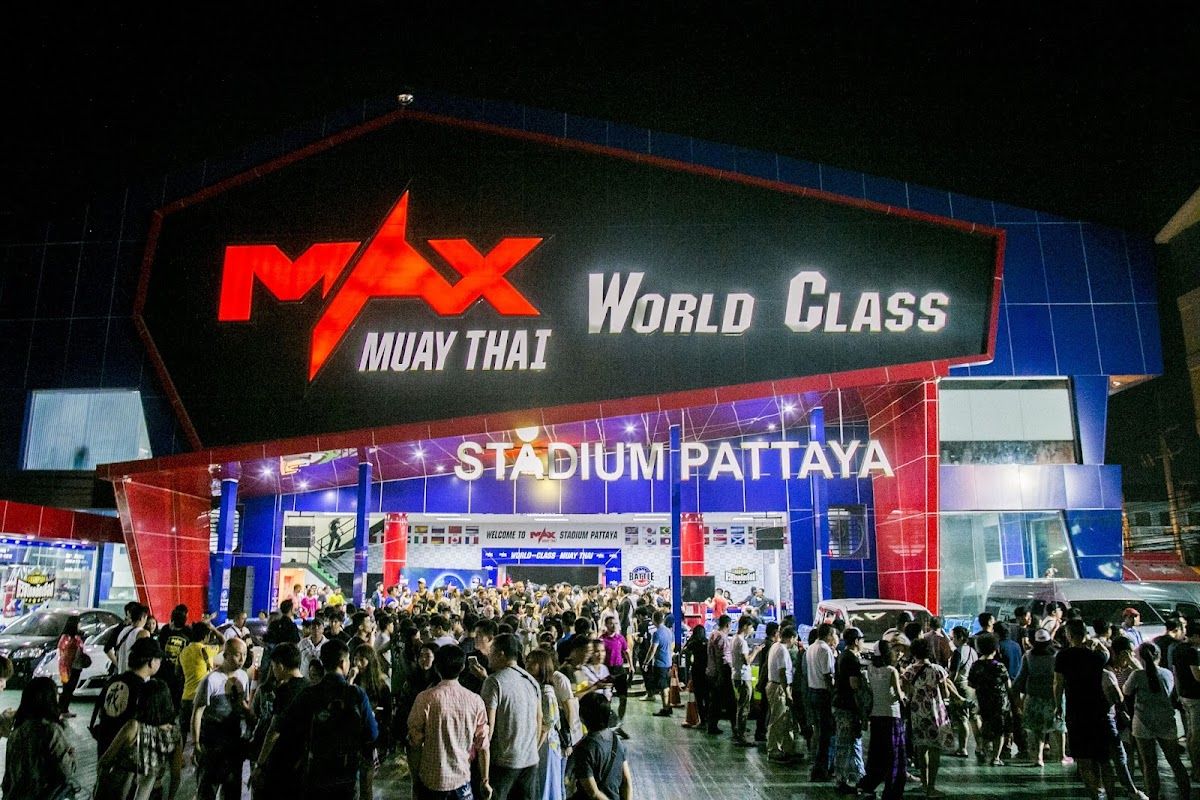 Muay Thai fighters in action at Pattaya stadium under the lights