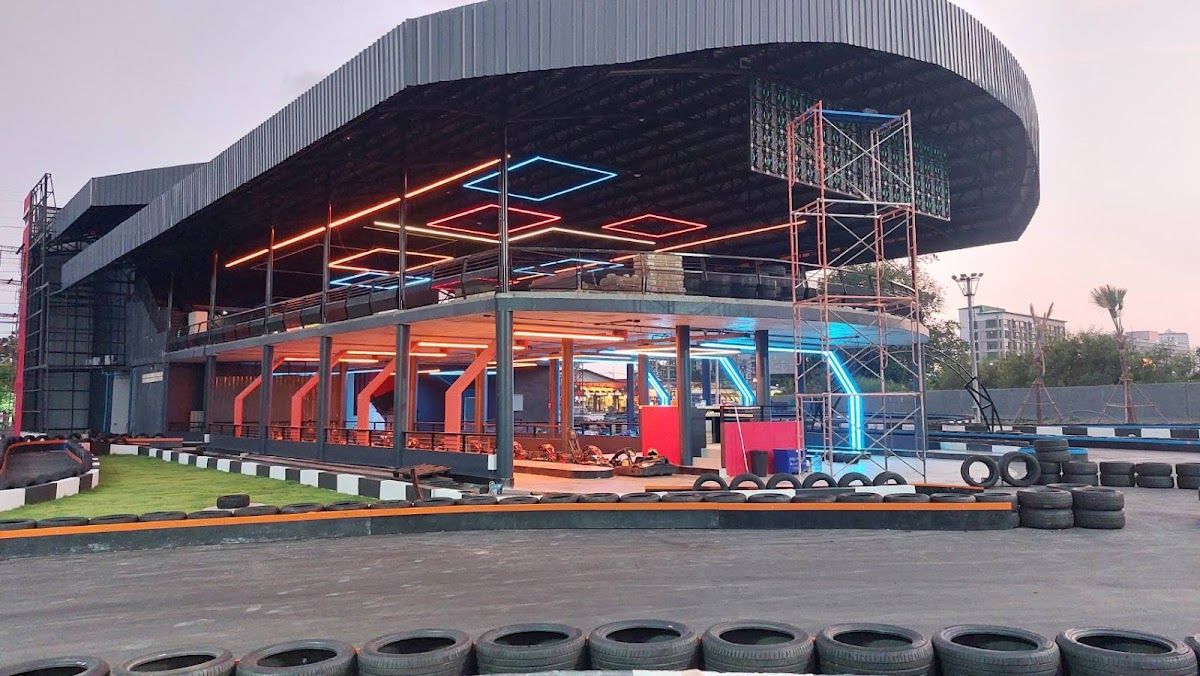 EasyKart go-kart track in Pattaya — a multi-level racing venue with tyre barriers and neon lighting