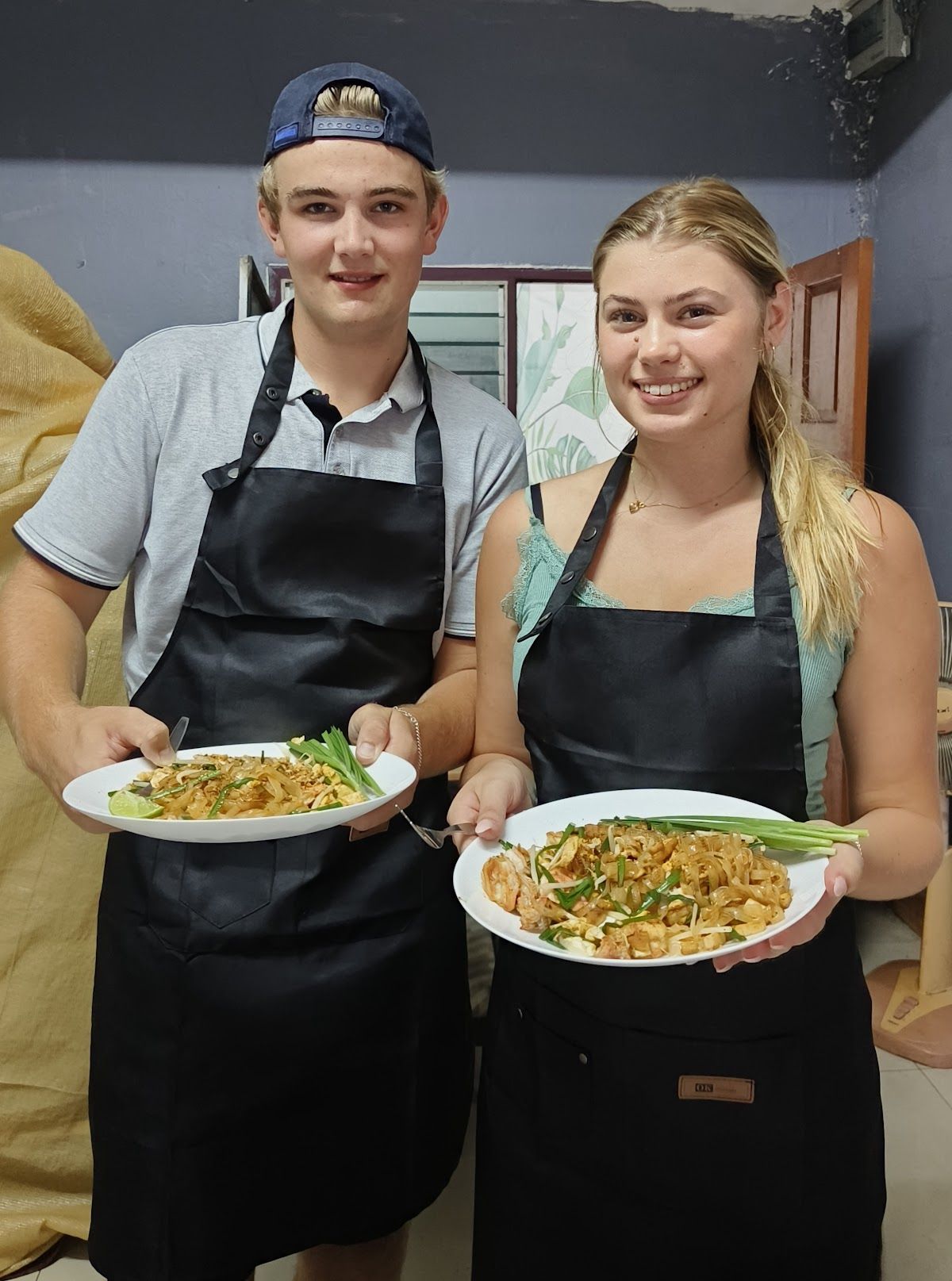 Hands-on Thai cooking class in Pattaya with fresh ingredients and wok on a gas burner