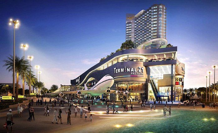 Inside Central Festival mall on Beach Road, Pattaya — the "Central" branded interior with escalators and corridors leading to ground-floor provider counters