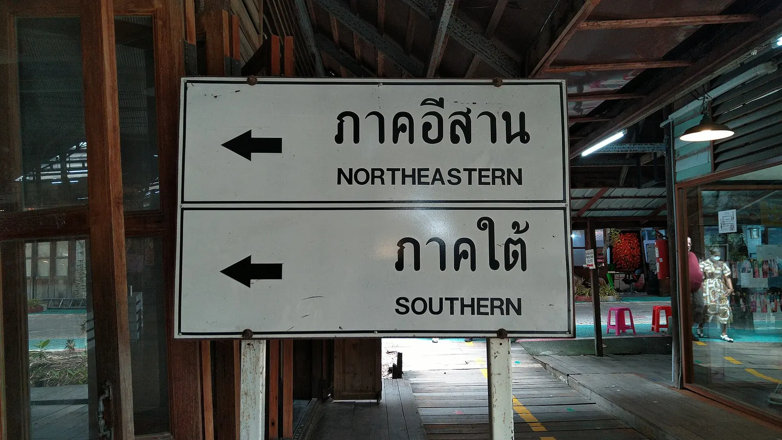 Covered food stalls along the canal at Pattaya Floating Market