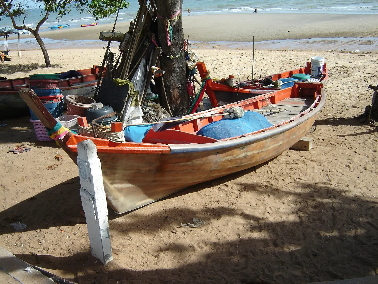 Jet skis and a small boat pulled up on Jomtien Beach