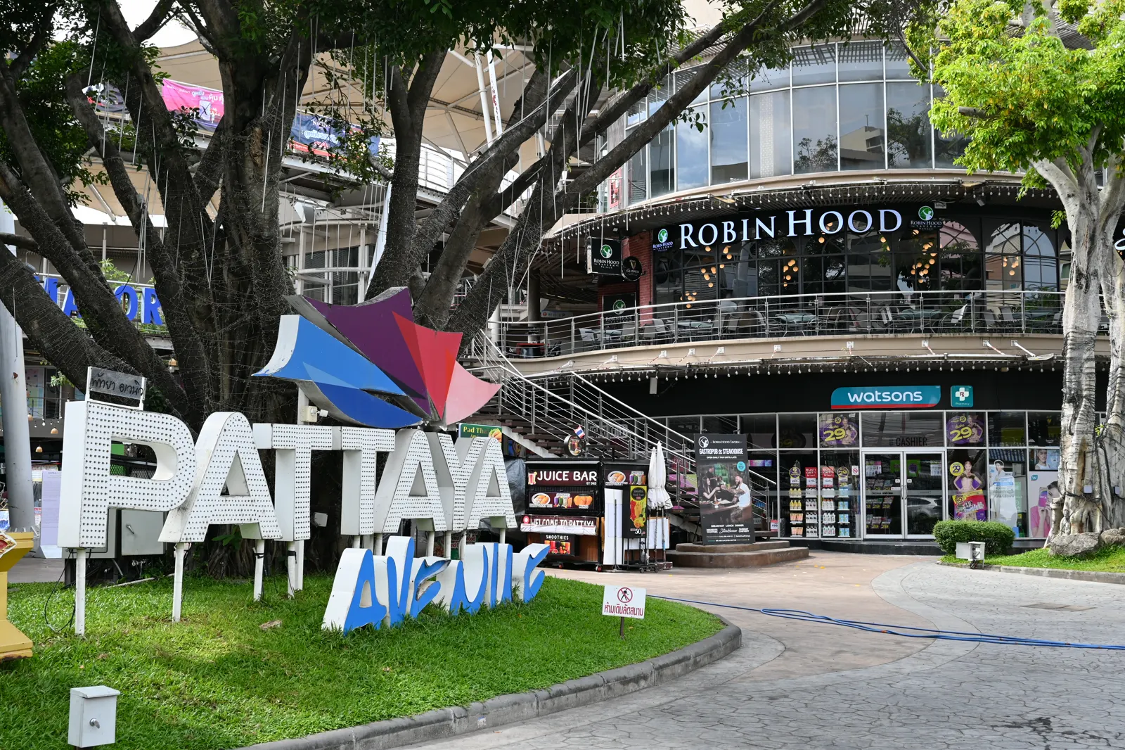 Pattaya Avenue, with a Watsons sign in the background, not a hospital