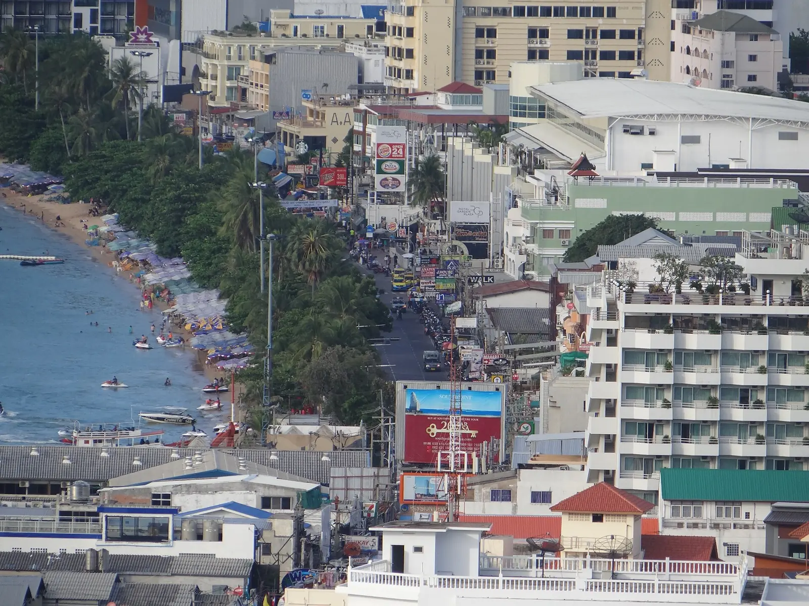Pattaya Beach Road and the bay seen from a hill, with hotels along the sand