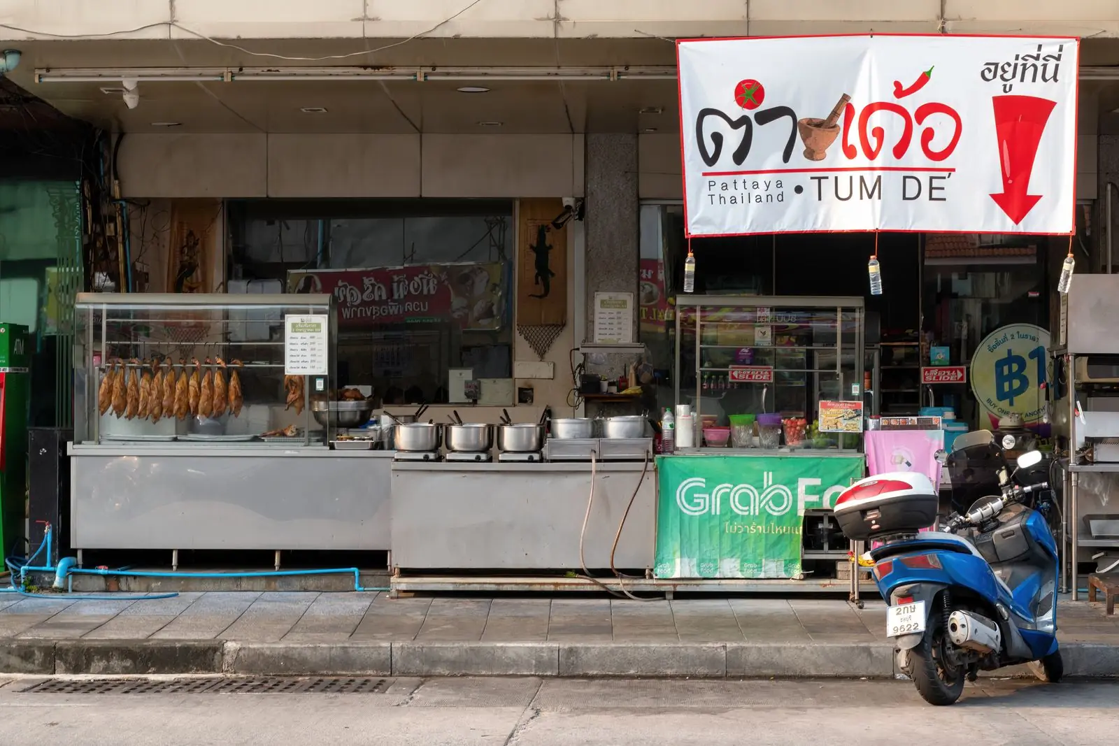 Roast ducks hanging at a street stall on a Pattaya road