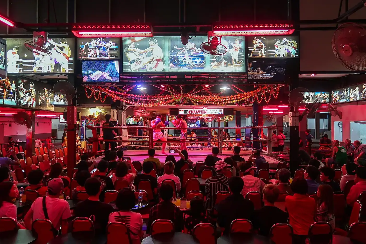 Walking Street Pattaya at night, the strip where most go-go bar fines are paid to the venue