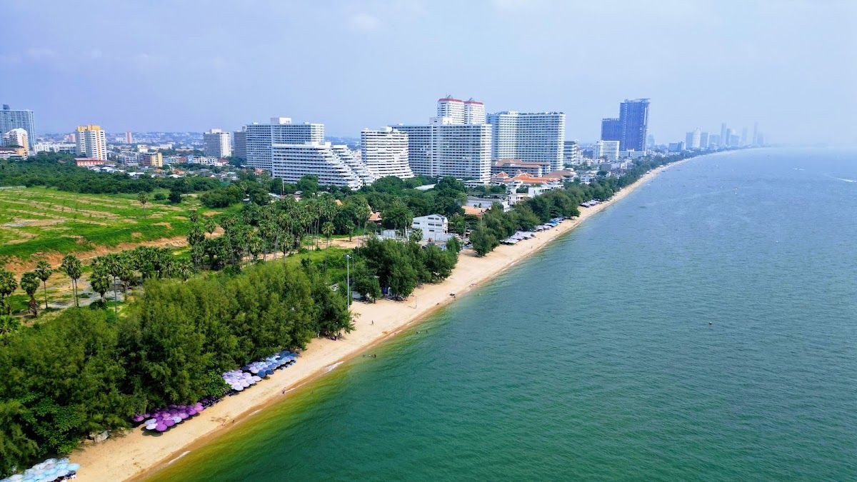 Turquoise water and white sand beach on a tropical island off the coast of Pattaya Thailand