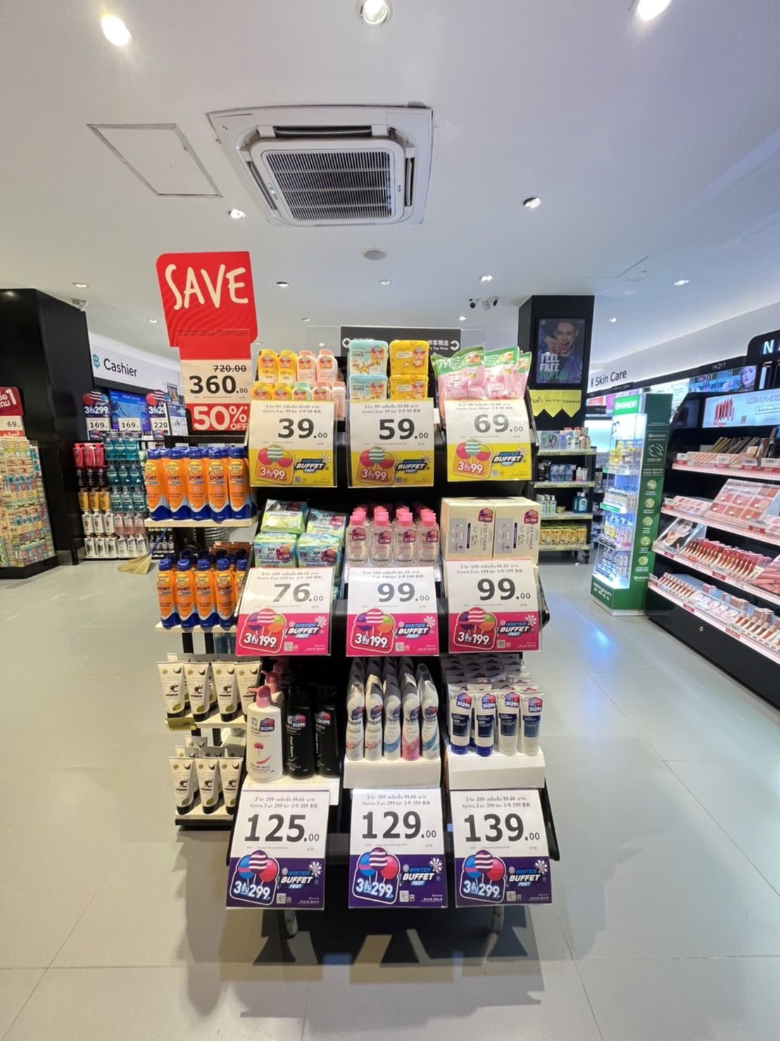 Interior of a Watsons pharmacy in Thailand showing shelves of health and beauty products