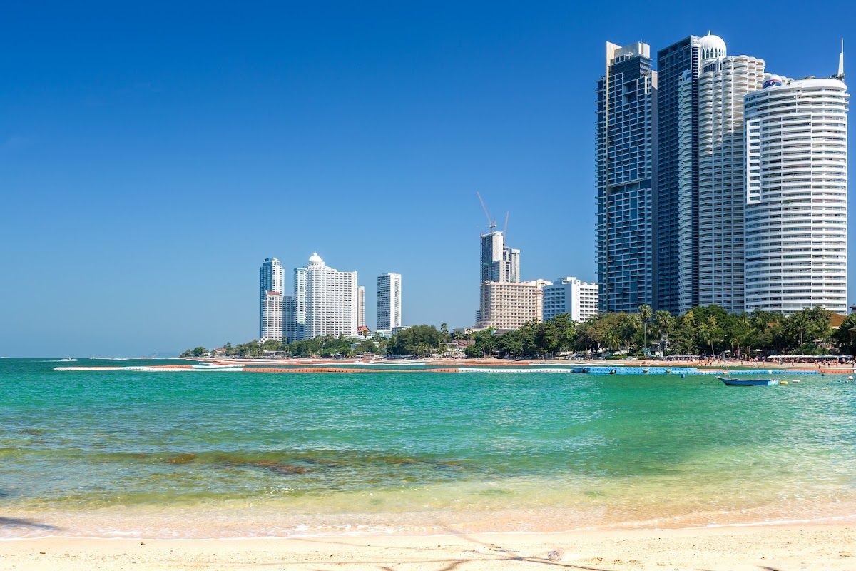 Wongamat Beach in north Pattaya with green-blue sea and high-rise resort hotels along the shore