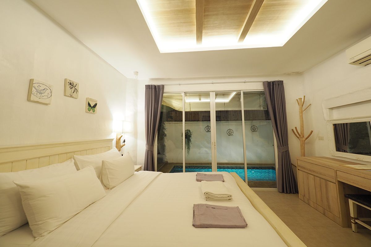 Costa Village Pool Villa Hotel pool and grounds in Jomtien Beach