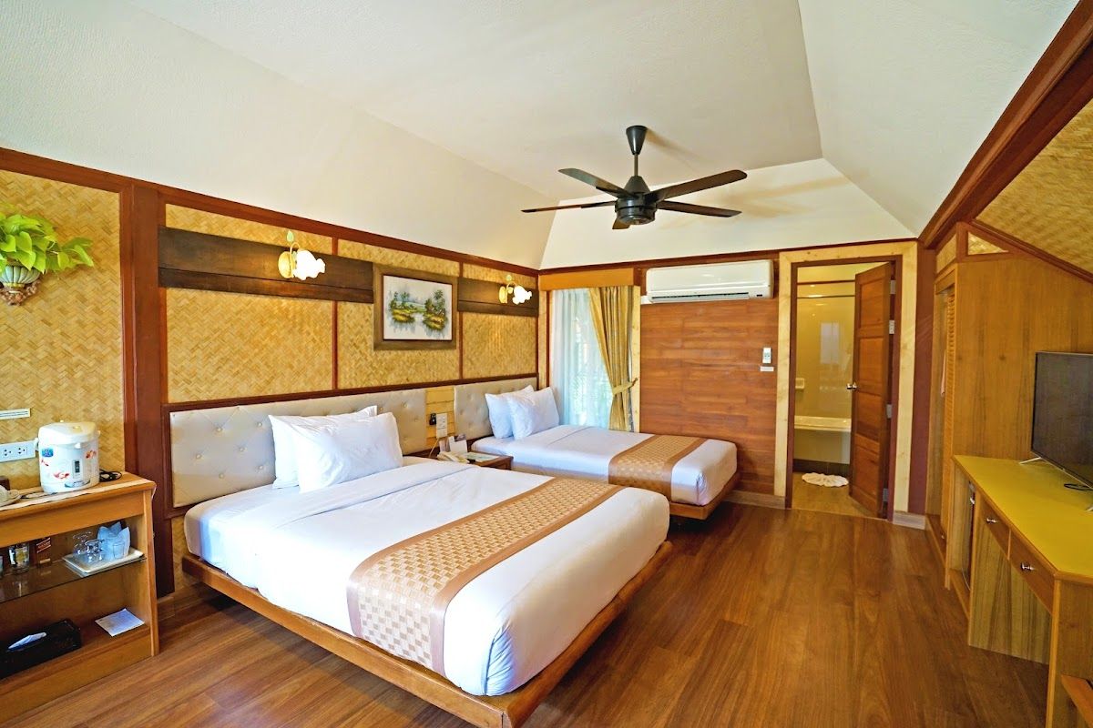 Sunset Village Beach Resort pool and grounds in Bang Saray